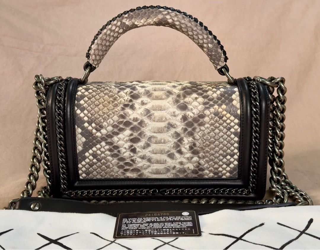 Chanel Le Boy Snake Skin Bag (Category: Luxury Bags & Wallets) located in Manila. Submitted by jpclassics (Listing ID 1285082004, Image 2). Description: Chanel Le Boy Snake Skin Bag with silver hardware. Japan sourced Authenticity not guaranteed Made in Italy In pristine condition. Black lambskin, snake skin front flap and top handle, with silver chain link and black leather padded shoulder strap. With Dust Bag Authenticity card got lost 2 mos ag