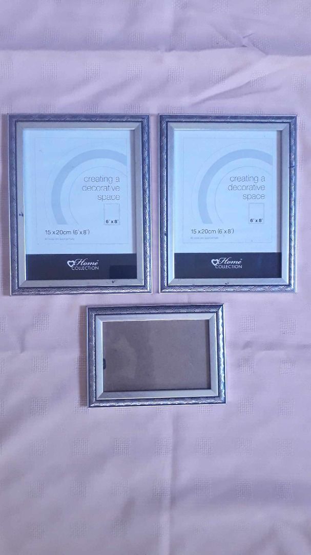 Home Collection Bundle of 3 Silver Toned Lightweight Frames (Category: Frames & Pictures) located in Quezon City. Submitted by jojoleen28 (Listing ID 1285122587, Image 1). Description: Scratches on frames as seen in photos 2 Large frames fits photos 6" x 8" 1 smaller frame fits photo 6" x 4" #Sale2026.