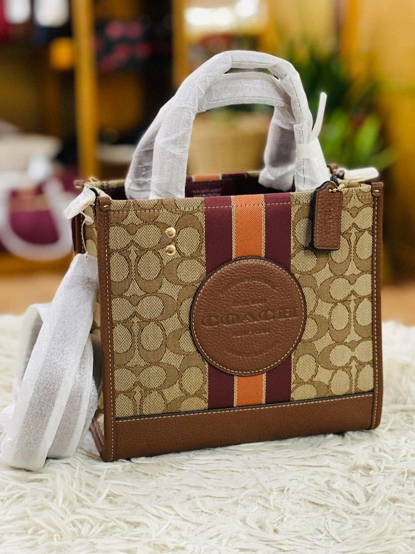 💯ORIGINAL COACH DEMPSEY 22 KHAKI ORANGE STRIPE (Category: Luxury Bags & Wallets) located in Quezon City. Submitted by ashongsstore (Listing ID 1285128932, Image 1). Description: 🐎C0AÇH COLLECTION 🐎 🇵🇭ONHAND🇵🇭 ‼️Please look at our pictures as that is exactly what you are purchasing‼️ 💯GUARANTEED ORIGINAL AND AUTHENTIC or TRIPLE YOUR MONEY BACK! Not REPLICA, OEM, TOP GRADE QUALITY, AUTHENTIC QUALITY or Any other Terms to DENOTE FAKE! 😎 . .
