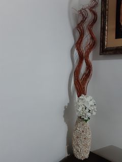 Rattan stems with flower ans vase