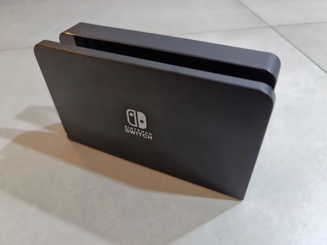 Switch OLED dock (Category: Nintendo) located in Singapore. Submitted by sufick1986 (Listing ID 1285215511, Image 1). Description: - oled dock - can be used with v1 and v2 switch.