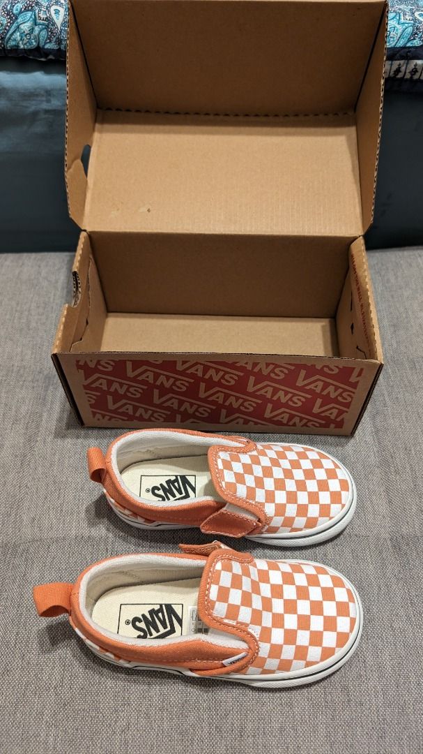 Orange checkerboard slip on best sale vans