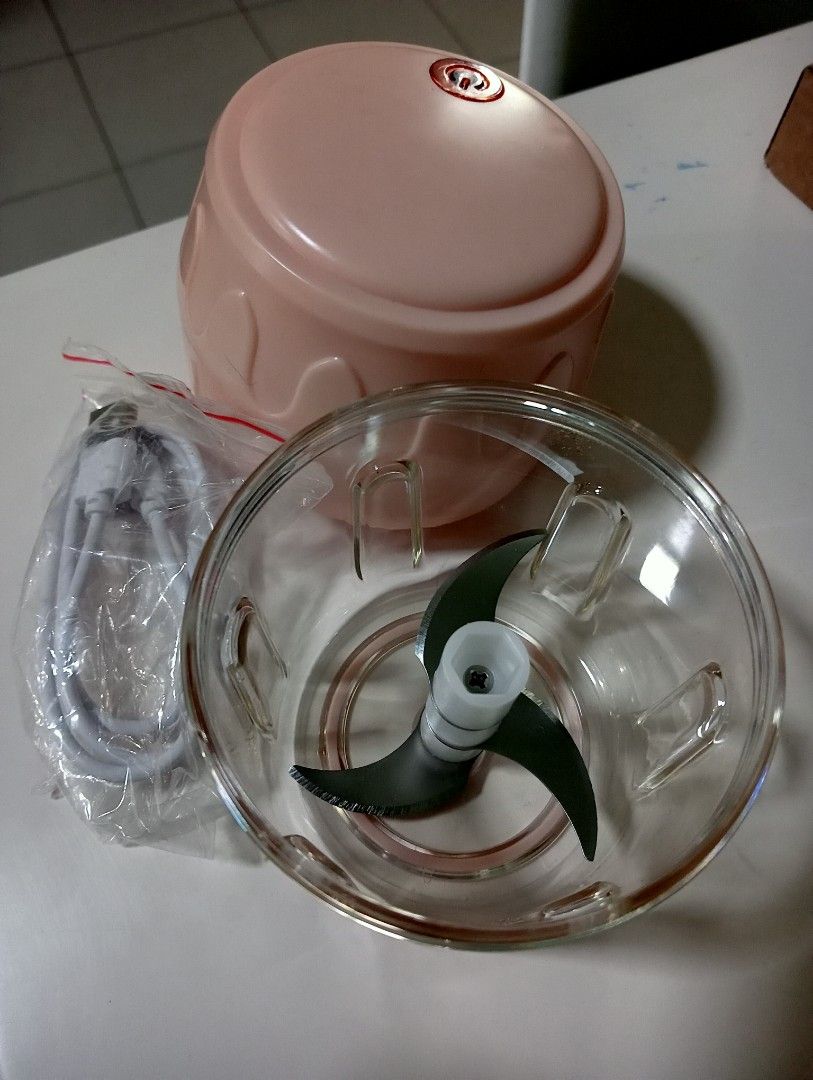 WIRELESS CHOPPER (Category: Juicers, Blenders & Grinders) located in Singapore. Submitted by buddymoverz (Listing ID 1285122829, Image 2). Description: Brand new but doesn't come with box. Charges using USB wire which is also provided. Very handy. Selling because I have this extra brand new set. Can self collect at Woodlands rise.