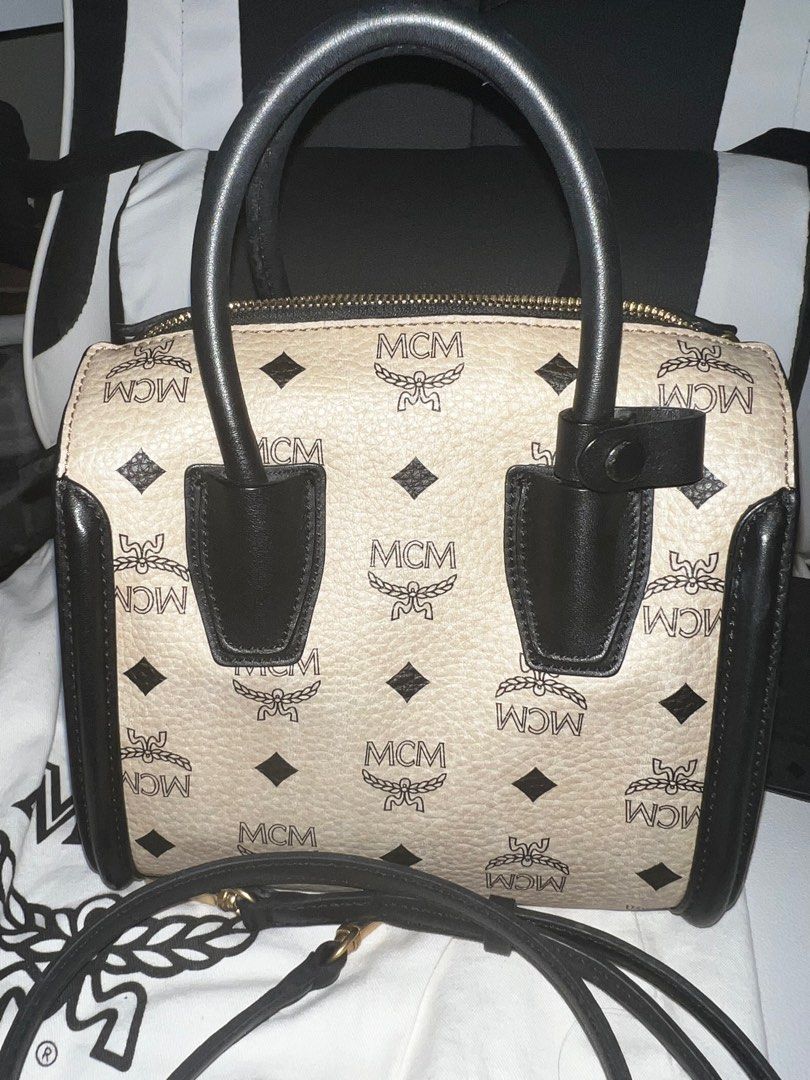 MCM BOSTON BAG MINI VISETOS BAG AUTHENTIC (Category: Luxury Bags & Wallets) located in Mandaluyong City. Submitted by leajiwon (Listing ID 1285364175, Image 2). Description: Seldom used. mcm visetos top handle mini satche. Includes protection bag and mini envelope for care cards & leaflets Cream color Only missing is the serial number card. Cant find it na You can check it @Twin oaks place shaw blvd .