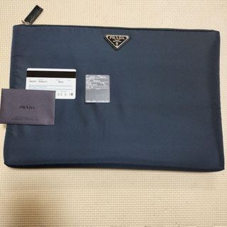 Prada clutch bag with guarantee card