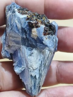 Raw kyanite specimen with inclusions red/blk tourmaline