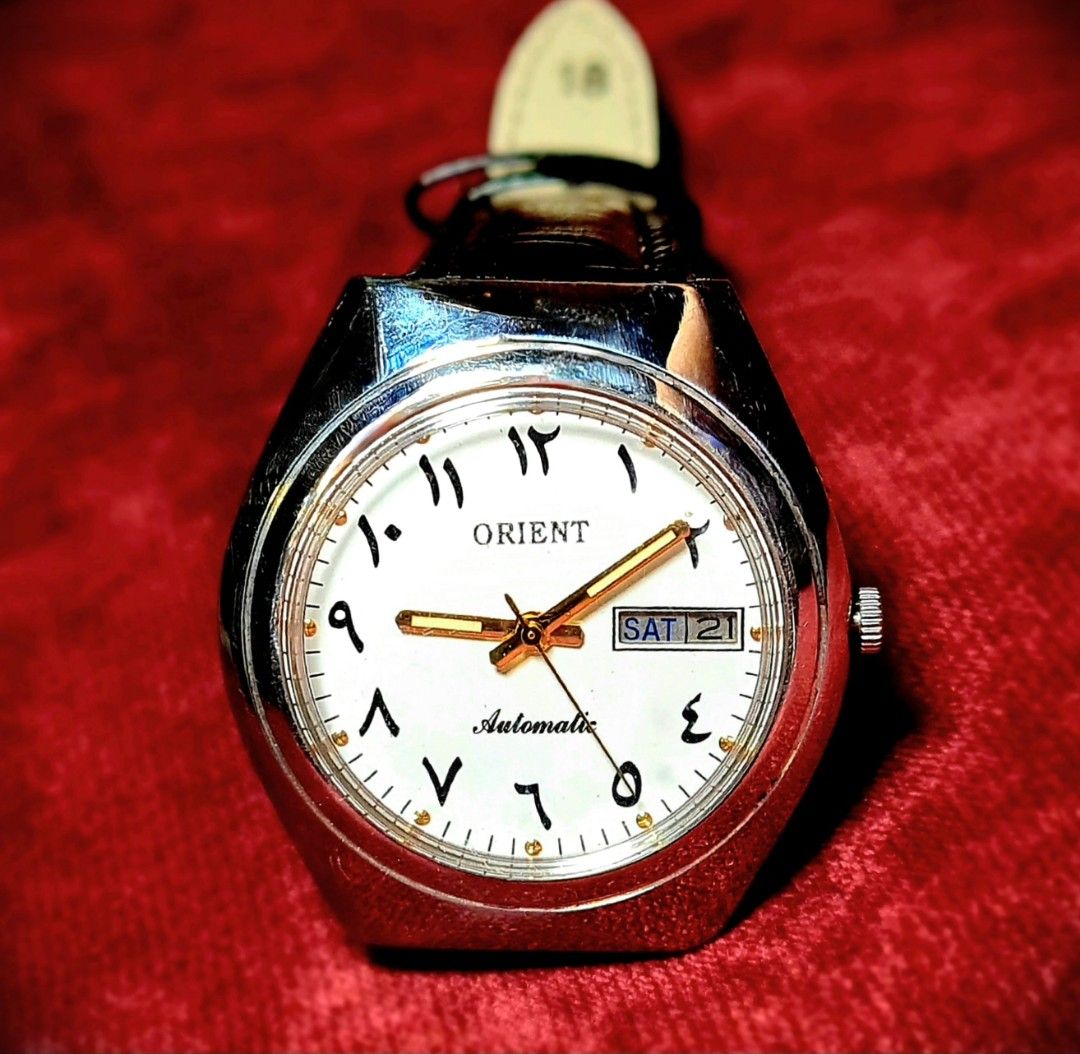 #Beautiful Vintage Watch #Orient #Automatic #Arabic Numerals (Category: Luxury Watches) located in Caloocan City. Submitted by allig8 (Listing ID 1285686204, Image 2). Description: This ORIENT Japan watch boasts a stunning silvery case with a beautiful white dial that features unique Arabic hour markers as indices. The 39mm case houses a reliable automatic movement with 21 jewels, ensuring accurate timekeeping that will last beyond a lifetime. Th