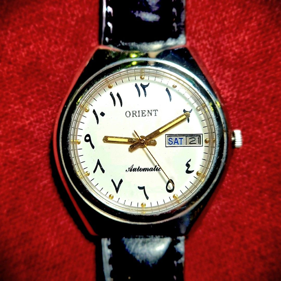 #Beautiful Vintage Watch #Orient #Automatic #Arabic Numerals (Category: Luxury Watches) located in Caloocan City. Submitted by allig8 (Listing ID 1285686204, Image 1). Description: This ORIENT Japan watch boasts a stunning silvery case with a beautiful white dial that features unique Arabic hour markers as indices. The 39mm case houses a reliable automatic movement with 21 jewels, ensuring accurate timekeeping that will last beyond a lifetime. Th