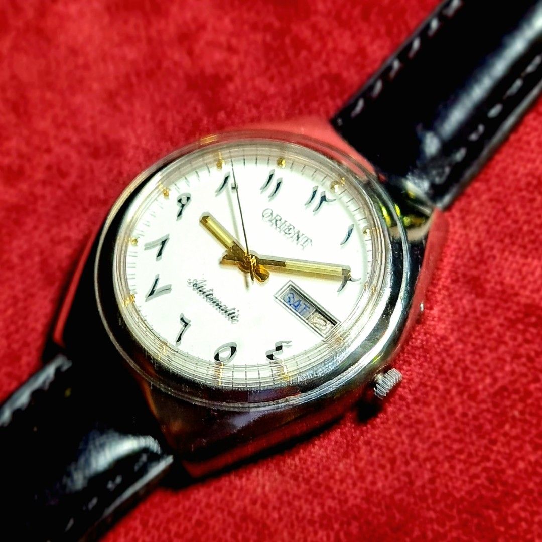 #Beautiful Vintage Watch #Orient #Automatic #Arabic Numerals (Category: Luxury Watches) located in Caloocan City. Submitted by allig8 (Listing ID 1285686204, Image 3). Description: This ORIENT Japan watch boasts a stunning silvery case with a beautiful white dial that features unique Arabic hour markers as indices. The 39mm case houses a reliable automatic movement with 21 jewels, ensuring accurate timekeeping that will last beyond a lifetime. Th