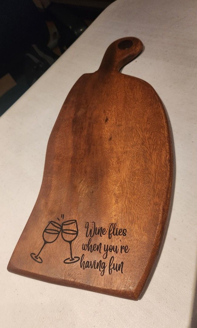 Cheeseboard with engraving (Category: Knives & Chopping Boards) located in Cainta. Submitted by mama.sells (Listing ID 1285692307, Image 1). Description: *set your party starters in this wood paddle board* size - 16.5" (total length) x 6.75 x .5" thick material - acacia wood with engraving.