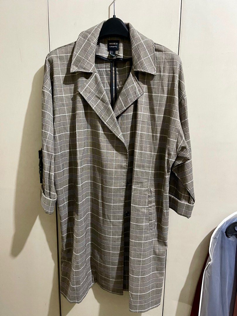 Forever 21 Brown Plaid Light Trenchcoat (Category: Coats, Jackets and Outerwear) located in Makati City. Submitted by mpr3rd (Listing ID 1285658910, Image 1). Description: Used once and kept. Chest - 26” Shoulder - 25.5” Length - 38”.