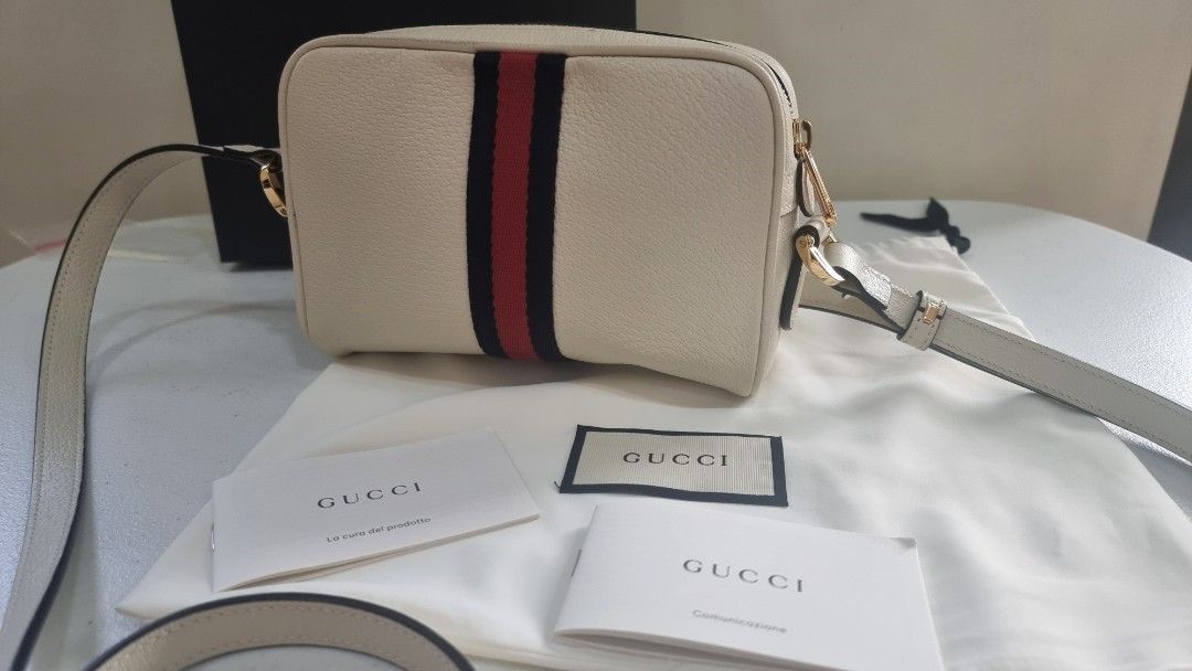Gucci Ophidia GG Supreme Mini Bag (Category: Luxury Bags & Wallets) located in Pasig City. Submitted by dextr (Listing ID 1285649497, Image 3). Description: Gucci Ophidia GG Supreme Crossbody Mini Bag • Gold-toned hardware • Cotton linen lining • Attached key ring that can attach to a separate bag • Front zipper pocket • Interior open pocket • Adjustable shoulder strap with a 23.6" drop • Zipper closure • 6.8" Wx 4.7" H x 2.1"'D • Weight: 0.66lbs
