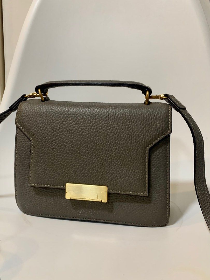 Thavma Two Way Crossbody Bag (Category: Luxury Bags & Wallets) located in Teresa. Submitted by savvyonbranded (Listing ID 1285691507, Image 2). Description: ✅ preloved thavma romi micro structured two way sling bag ✅ korean luxury brand ✅ dimensions : 15 x 20 x 7 cm ✅ minor issue : 💕 some faded parts on leather body and strap ( pls check all photos ).