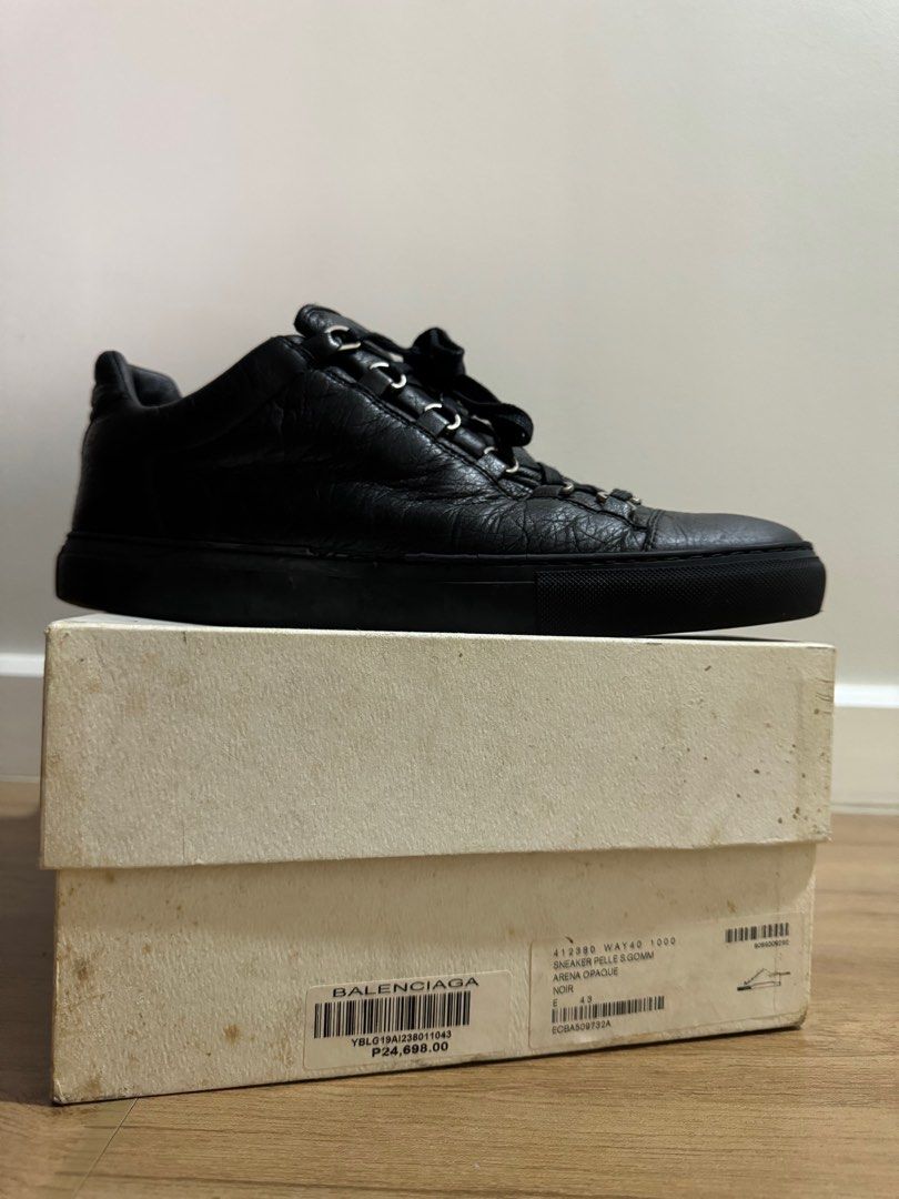 Balenciaga Arena Low Black (Category: Sneakers) located in Taguig. Submitted by jcs86 (Listing ID 1290542911, Image 2). Description: Issue: Rubber chipping as indicated in photos (not too noticeable from afar, does not affect stitching) Complete with box, dustbag and extra laces.