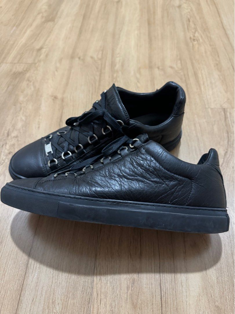 Balenciaga Arena Low Black (Category: Sneakers) located in Taguig. Submitted by jcs86 (Listing ID 1290542911, Image 3). Description: Issue: Rubber chipping as indicated in photos (not too noticeable from afar, does not affect stitching) Complete with box, dustbag and extra laces.