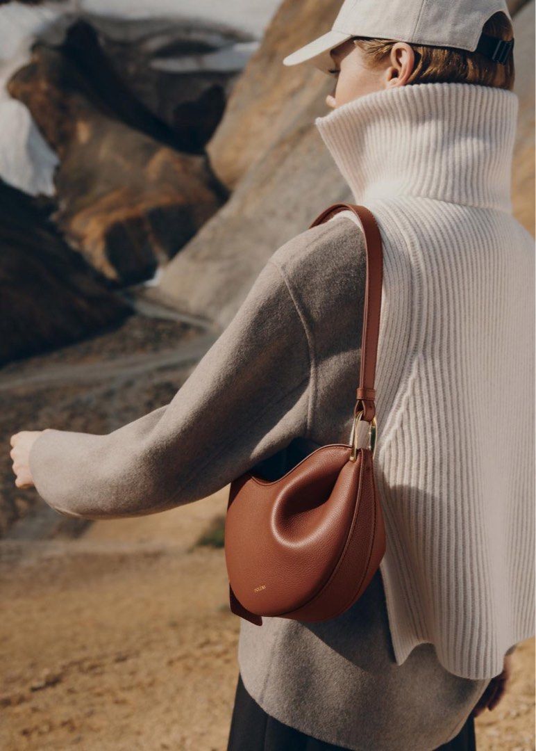 💯ORIGINAL POLENE TONCA COGNAC (Category: Luxury Bags & Wallets) located in Quezon City. Submitted by ashongsstore (Listing ID 1290493148, Image 2). Description: Pre-Order Tonca EDITION TEXTURED COGNAC Obtained by modeling the leather on a wooden mould, the “Tonca” bag’s roundness is shaped by its folds that blend into a twisted metal buckle. The bag’s contrasting body and shoulder strap feature smooth and textured leathers. Dimensions: 17 x 24 x