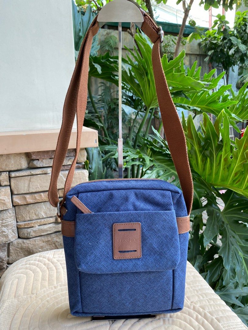 BEANPOLE Sling Bag (Category: Sling Bags) located in Baliuag. Submitted by nylinel (Listing ID 1292102333, Image 1). Description: 👜 BEANPOLE Sling Bag 💼 For men 💛 Color: Blue and Brown ⛔️ Size: L- 8.5” x H- 9.5” x W- 2.5” 💯 Guaranteed Original 🎒 preloved - in very good condition.