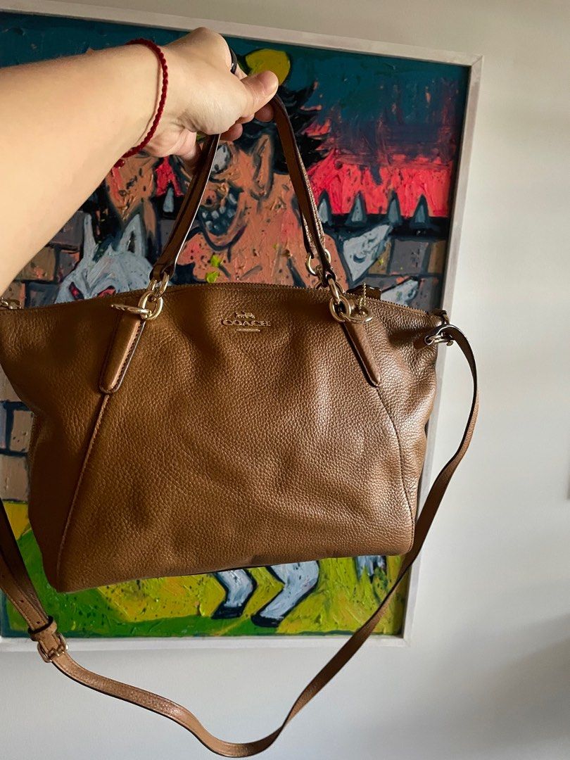 Coach Satchel Handbag (Category: Shoulder Bags) located in Taguig. Submitted by mdjpl (Listing ID 1292158369, Image 1). Description: Brown camel color Brand New, just stored with care instructions Handbag with crossbody strap RFS: Decluttering, selling low **if interested , please pay for shipping.