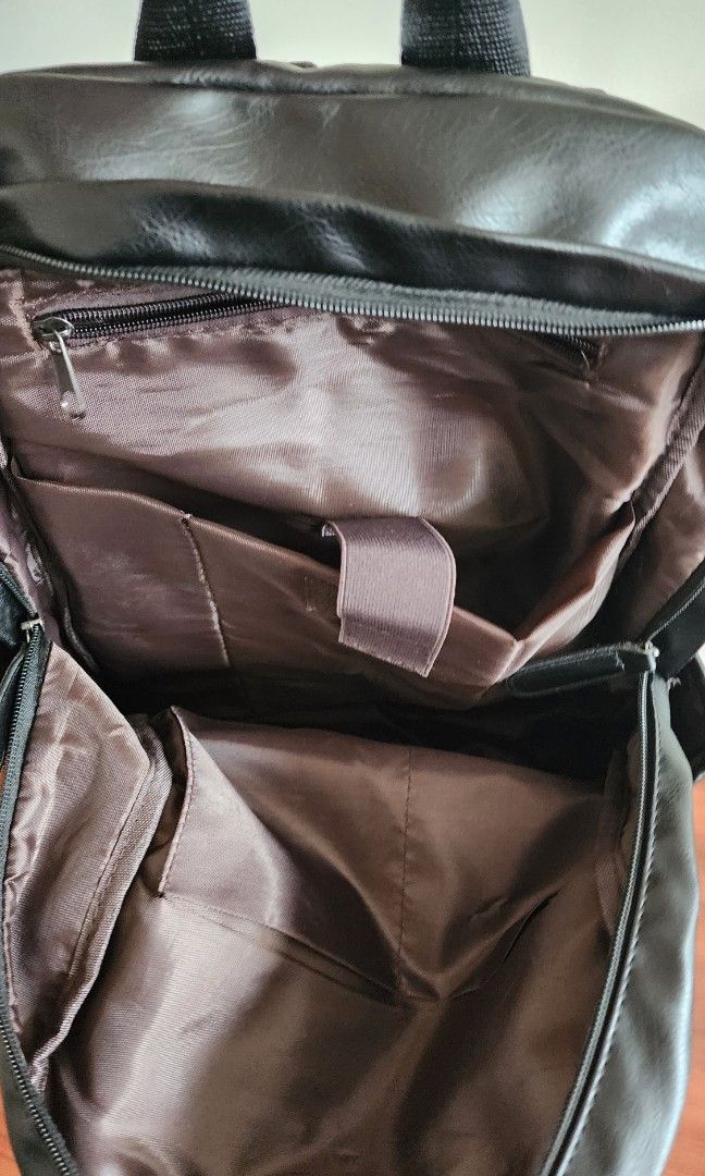 PVC bag pack (Category: Backpacks) located in Singapore. Submitted by donewithcare (Listing ID 1292213402, Image 3). Description: almost new PVC backpack (looks like leather). It has many compartments and an internal laptop sleeve..