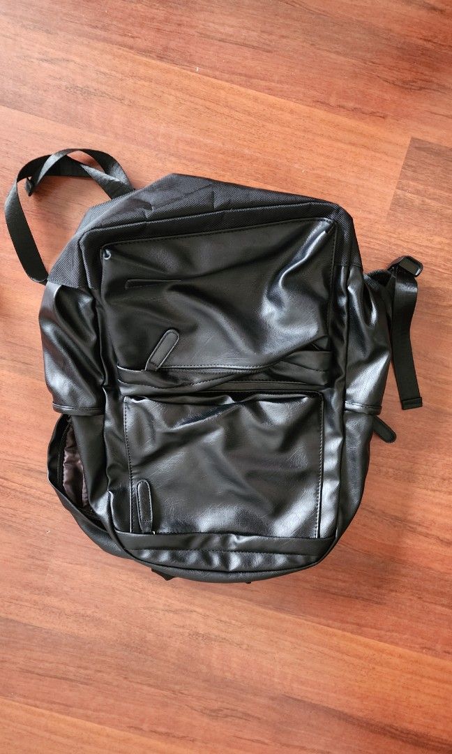 PVC bag pack (Category: Backpacks) located in Singapore. Submitted by donewithcare (Listing ID 1292213402, Image 1). Description: almost new PVC backpack (looks like leather). It has many compartments and an internal laptop sleeve..