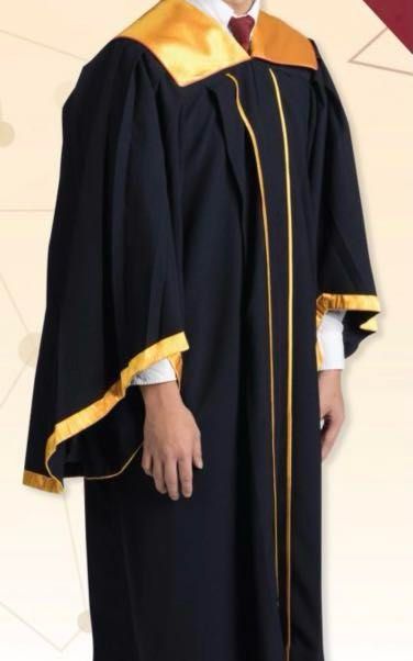 A woman in a graduation gown holding a diploma photo – Free Student Image  on Unsplash