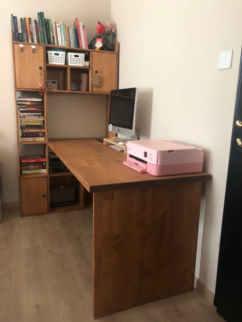 Study desk / table (Category: Tables & Sets) located in Singapore. Submitted by dadaa16 (Listing ID 1292334185, Image 1). Description: To further clarify, entire depth is 1m, while the inner depth is 70cm, which makes the outer depth (shelf) 30cm. The length runs 1.8m. Highly functional with the open/closed shelves, it’s also fitted with two baskets attached under the table, there is no need to worry for messy cords or wires which allows easy cle