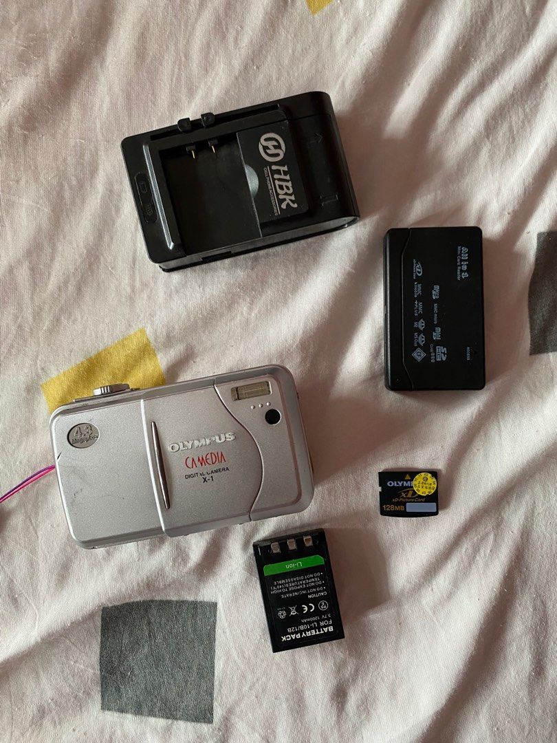 digi cam (Category: Cameras) located in Guagua. Submitted by mariana.items (Listing ID 1292458241, Image 1). Description: olympus digi cam sold as set only 10/10 working complete set (charger, battery, xd card) bought this from a legit digi collector price is negotiable rfs: not using it anymore .
