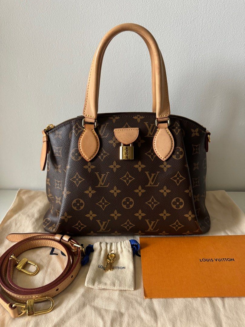 LV Rivoli in PM size two way bag (Category: Luxury Bags & Wallets) located in Cebu City. Submitted by simplyjoyce (Listing ID 1292525708, Image 2). Description: Preloved LV Rivoli in PM size Monogram Canvass excellent condition Inclusions: Dustbag, box, paperbag, receipt, padlock, two keys & removable strap Size: 121” L x 4” W x 9” H Handle Drop: 4” and 12-16” adjustable 78,000php Cash / Lay-away / Credit Card RFS: decluttering MOP: Bank Transfer