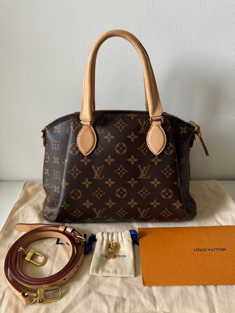 LV Rivoli in PM size two way bag (Category: Luxury Bags & Wallets) located in Cebu City. Submitted by simplyjoyce (Listing ID 1292525708, Image 3). Description: Preloved LV Rivoli in PM size Monogram Canvass excellent condition Inclusions: Dustbag, box, paperbag, receipt, padlock, two keys & removable strap Size: 121” L x 4” W x 9” H Handle Drop: 4” and 12-16” adjustable 78,000php Cash / Lay-away / Credit Card RFS: decluttering MOP: Bank Transfer