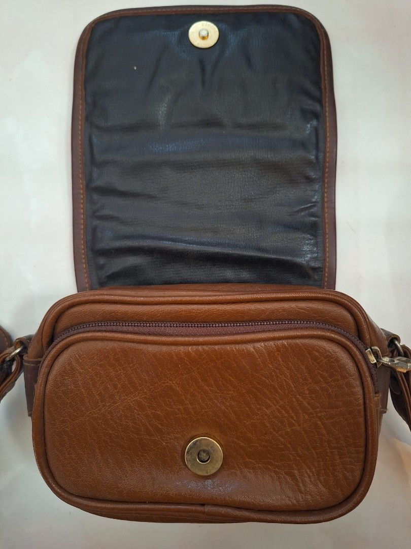 Pony Mini Sling Crossbody Bag (Category: Cross-body Bags) located in Manila. Submitted by cletzdeclutter (Listing ID 1292453711, Image 2). Description: Preloved Pony Mini Sling Bag Di kasya cp *BAWAL SA MAARTE AT MASELAN *Manage you expectations *May yupi ang hardware logo sa harap *Mejo mahirap buksan/isara ang zipper sa tagal na di nagamit *Kita sa photos ang condition ng item Rfs: decluttering.