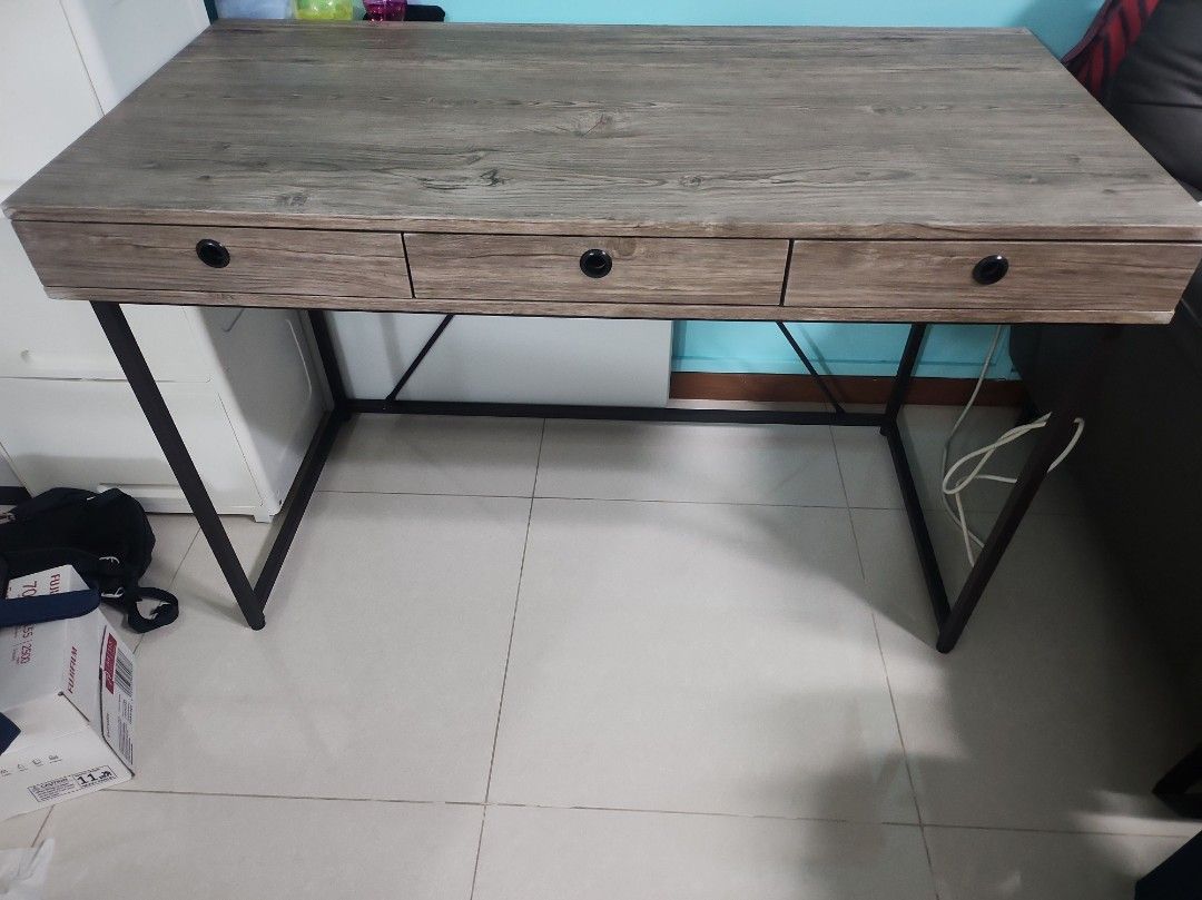 Working Table (Category: Tables & Sets) located in Singapore. Submitted by xcesskiosk (Listing ID 1292582437, Image 2). Description: Study/working table Bought from FortyTwo. minor scratch on the corner of the tables. Self-collect. 120cm (L) x 60cm (D) x 76.5cm (H).