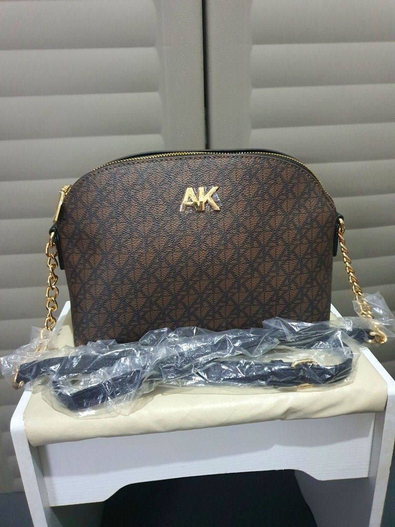 Anne Klein Dome Cross Body Bag (Category: Cross-body Bags) located in Pasay City. Submitted by dylan.fs (Listing ID 1292712237, Image 1). Description: Anne Klein Dome Crossbody Bag Description: * Combination of leather and gold chain sling. * Adjustable belt type sling * 3 compartments - 2 open pockets and 1 top zip * Internal: 4 card slots compartment, 1 zipper pocket Please check and zoom in on the photos for better appreciation. Measures appro
