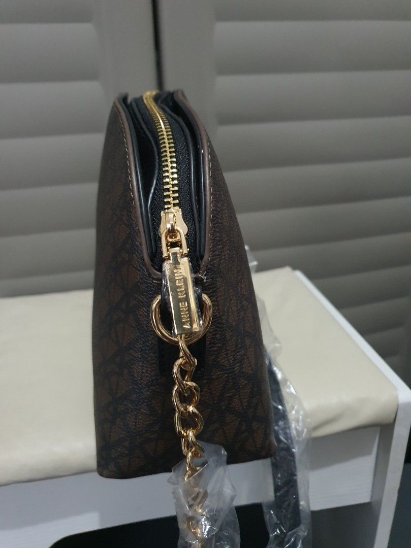 Anne Klein Dome Cross Body Bag (Category: Cross-body Bags) located in Pasay City. Submitted by dylan.fs (Listing ID 1292712237, Image 2). Description: Anne Klein Dome Crossbody Bag Description: * Combination of leather and gold chain sling. * Adjustable belt type sling * 3 compartments - 2 open pockets and 1 top zip * Internal: 4 card slots compartment, 1 zipper pocket Please check and zoom in on the photos for better appreciation. Measures appro