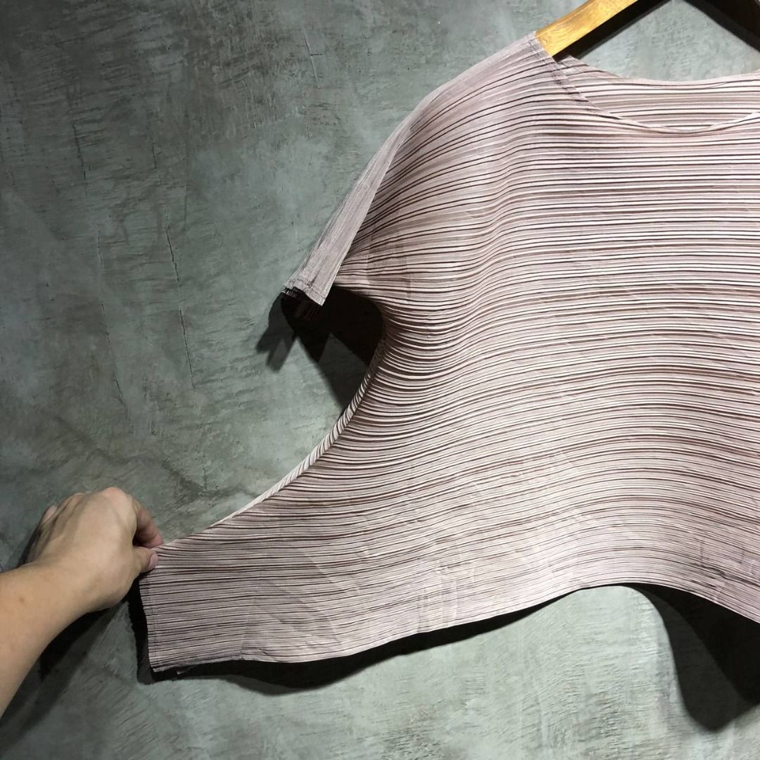 Issey Miyake Pleats Please Asymmetrical pleated Tee (Category: Luxury Apparel) located in Quezon City. Submitted by johnpaulperezzz (Listing ID 1292671217, Image 3). Description: NAME: Issey Miyake Pleats Please Asymmetrical pleated Tee COLOR: Beige SIZE: Free FIT: Medium Dimension: Width: 21 Length: 20 Shoulder: 18 Sleeves: 6 Hem: 35 CONDITION: 9/10 ISSUE: -none PRICE: 5k .