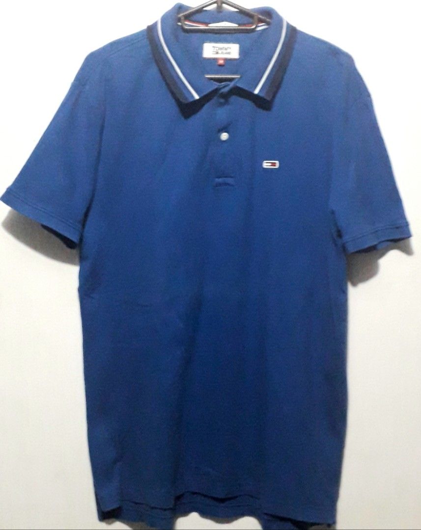 Tommy Jeans Polo Shirt (Category: Tshirts & Polo Shirts ) located in Muntinlupa City. Submitted by amoremac (Listing ID 1292767469, Image 1). Description: Regular fit Blue in color. Medium in size .Original Tommy Hilfiger Group !.