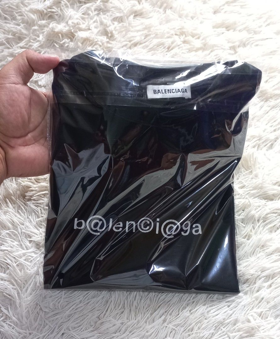Authentic balenciaga symbolic tshirt (Category: Luxury Apparel) located in Cebu City. Submitted by MrLiks_123 (Listing ID 1293190322, Image 1). Description: #admin Balenciaga symbolic tshirt Size small oversized Width 22.5 stretch to 23 Length 28 Heavy cotton "Crack on prints" 9.5/10 color and cloth condition Cebu location.