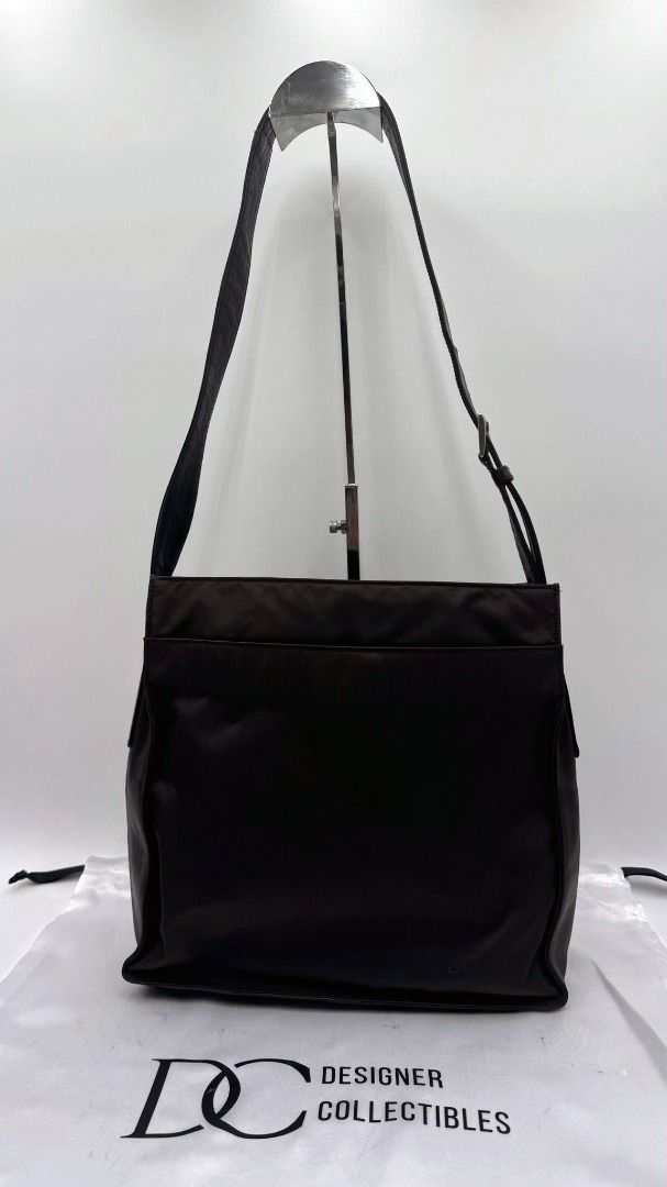 Authentic Prada Tessuto Nylon and Leather Shoulder Bag (Category: Bags & Wallets) located in Melbourne. Submitted by designercollectibles.com.au (Listing ID 1293197678, Image 2). Description: All items sold by DESIGNER COLLECTIBLES AUSTRALIA are authentic and authenticity guaranteed. Disclaimer: Designer Collectibles Australia is not associated or affiliated with the brand. All copyrights reserved to the original holder. Condition: Very Good. It 