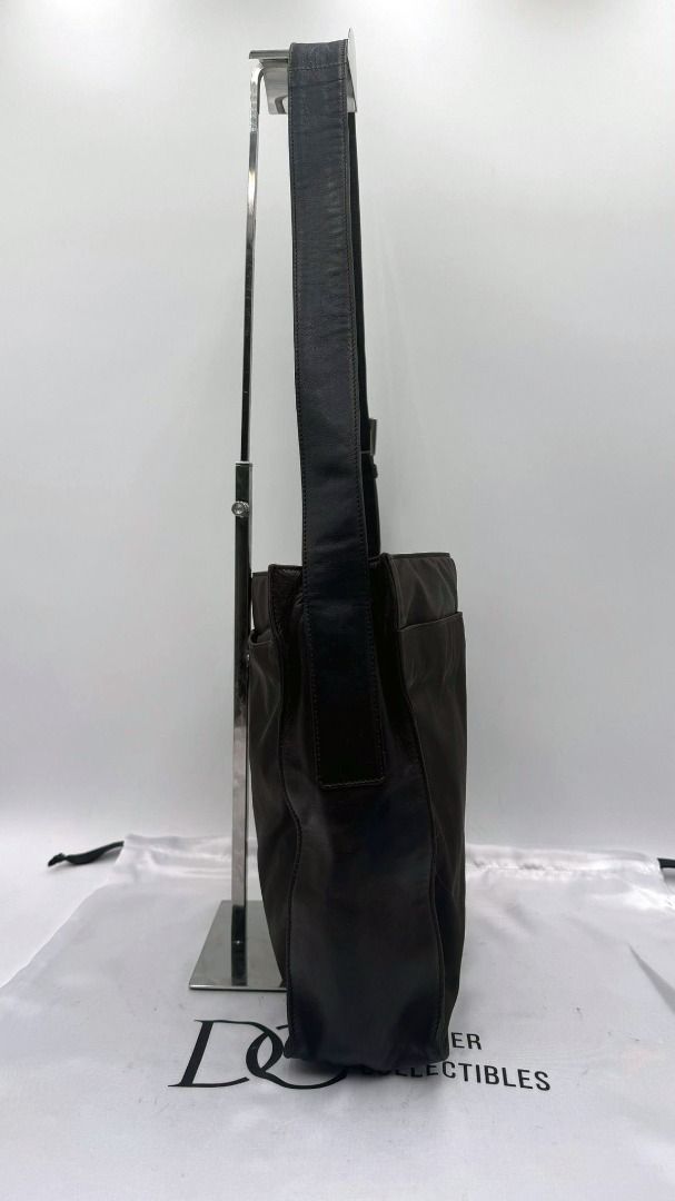 Authentic Prada Tessuto Nylon and Leather Shoulder Bag (Category: Bags & Wallets) located in Melbourne. Submitted by designercollectibles.com.au (Listing ID 1293197678, Image 3). Description: All items sold by DESIGNER COLLECTIBLES AUSTRALIA are authentic and authenticity guaranteed. Disclaimer: Designer Collectibles Australia is not associated or affiliated with the brand. All copyrights reserved to the original holder. Condition: Very Good. It 