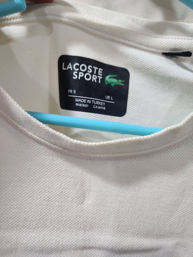 Lacoste White Tee (Category: Tshirts & Polo Shirts ) located in Lingayen. Submitted by brulee21 (Listing ID 1293304410, Image 2). Description: rfs: decluttering has minimal stain.