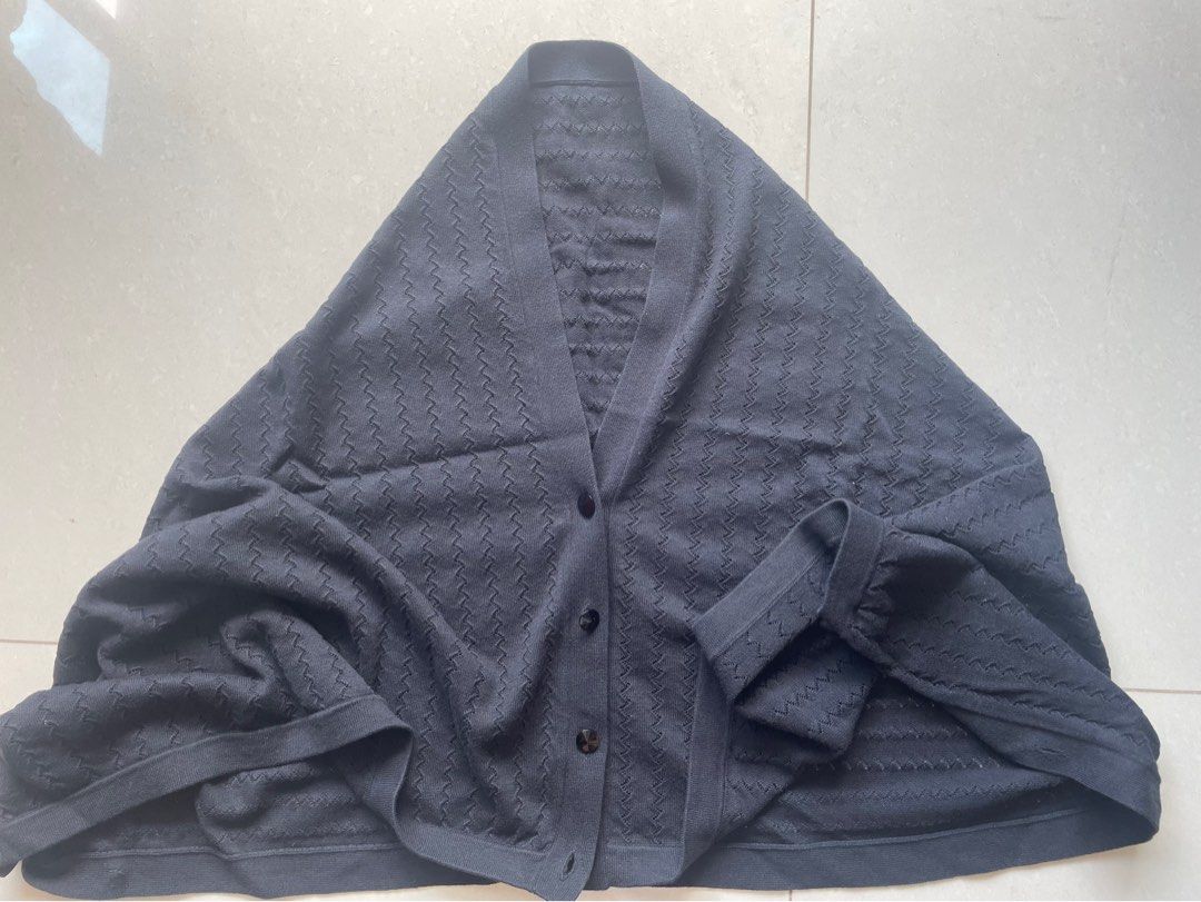 Versatile wrap (Category: Other Tops) located in Singapore. Submitted by pingyi16 (Listing ID 1293187905, Image 1). Description: Versatile wrap, can be worn a few different ways I think 4 buttons and button holes on each side Pls top up for mail out.