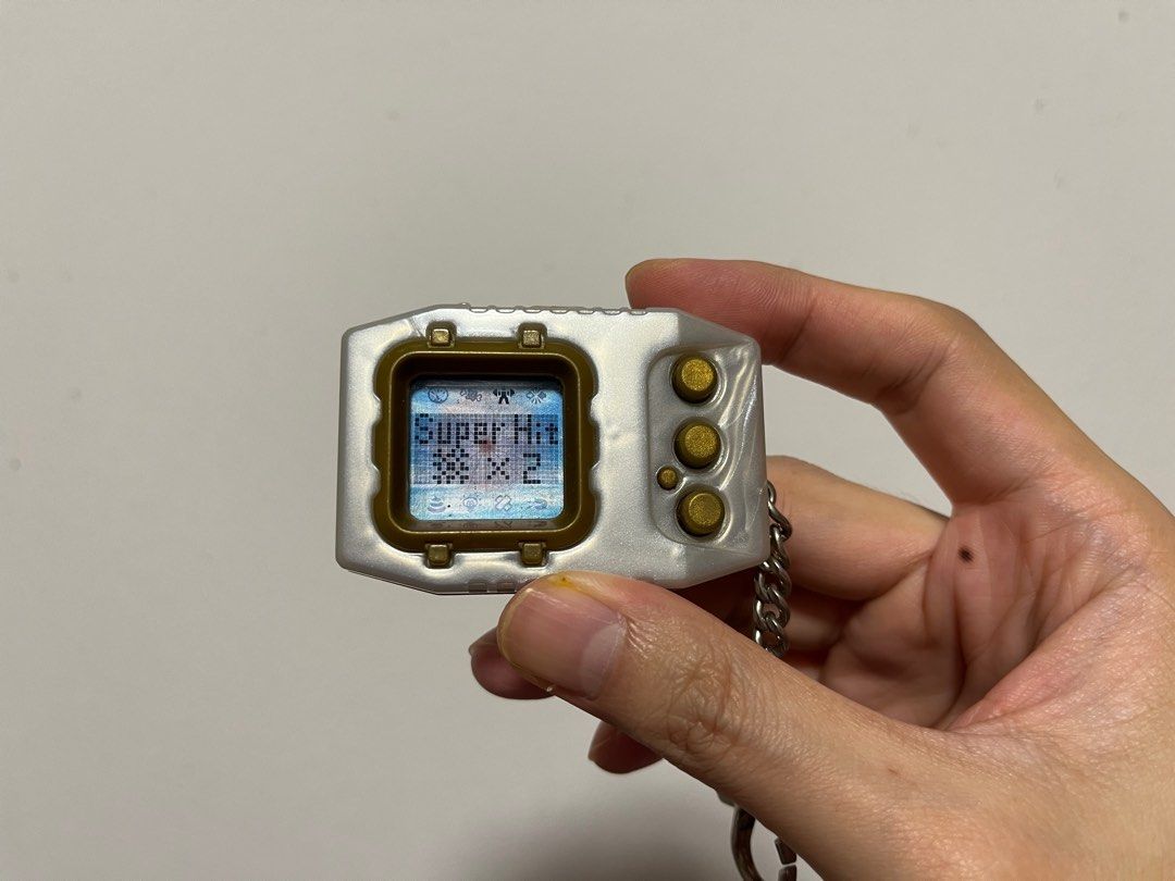 Digimon Pendulum Zero (Category: Interactive Toys) located in Singapore. Submitted by wayneteo (Listing ID 1293470346, Image 8). Description: Digimon Pendulum Zero Gold Frame. Everything working is as per photo. Sound is working. Condition close to mint. No box..
