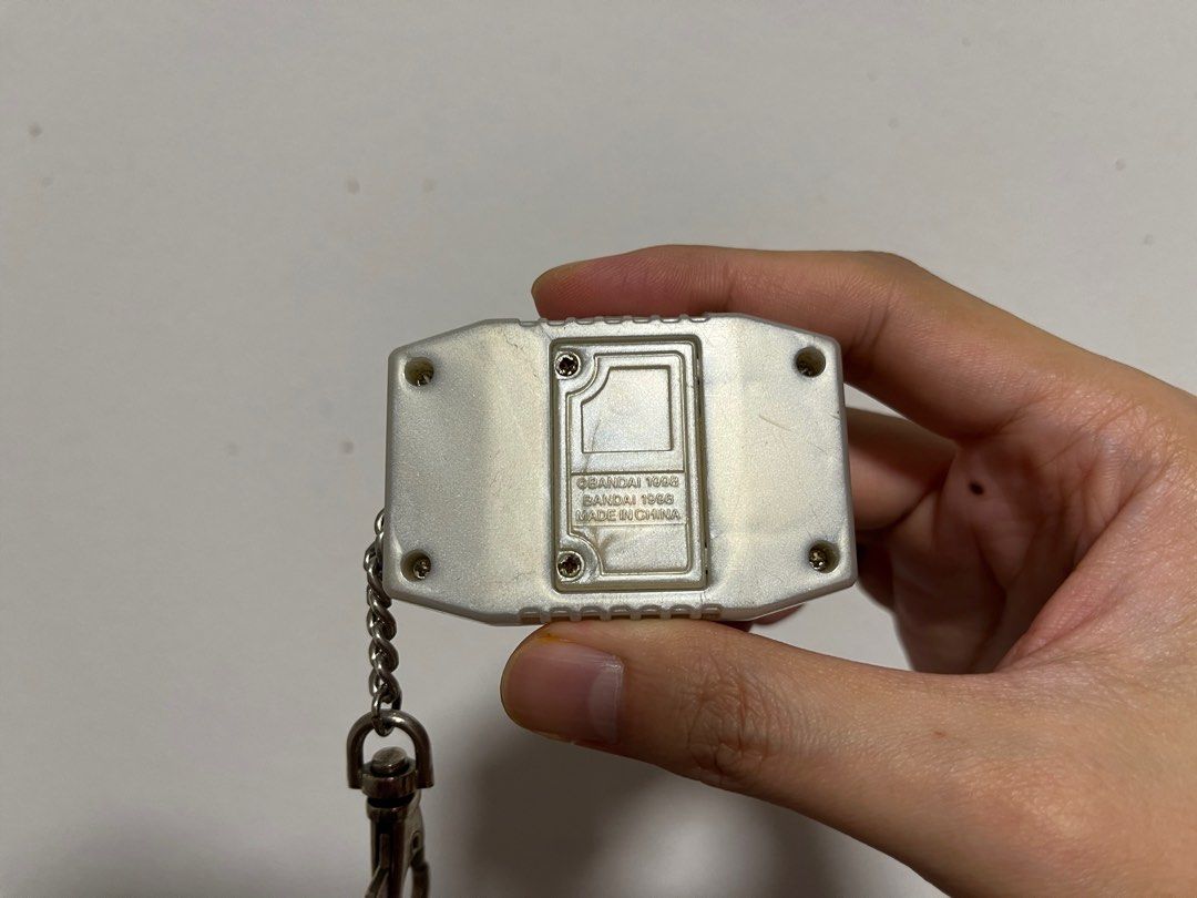 Digimon Pendulum Zero (Category: Interactive Toys) located in Singapore. Submitted by wayneteo (Listing ID 1293470346, Image 3). Description: Digimon Pendulum Zero Gold Frame. Everything working is as per photo. Sound is working. Condition close to mint. No box..