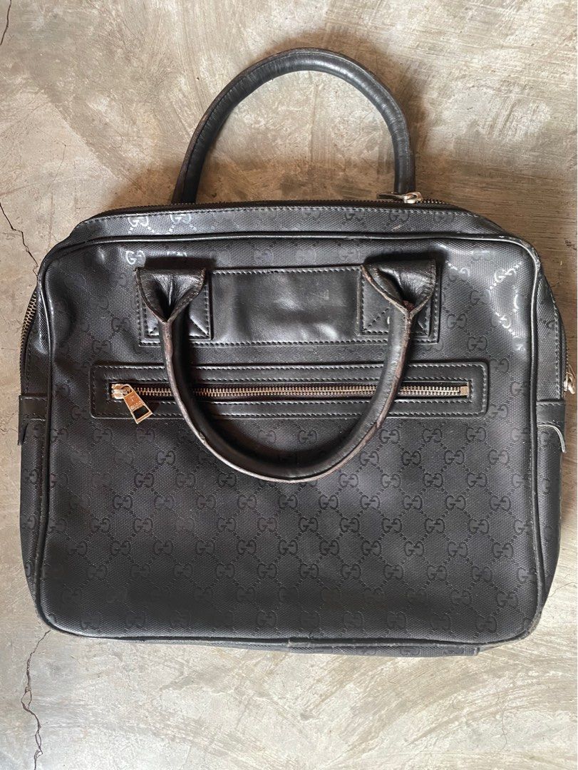 Gucci Laptop Bag (free shipping) (Category: Luxury Bags & Wallets) located in Calamba. Submitted by juan_jawnz (Listing ID 1293454419, Image 2). Description: What you see is what you get! It can fit documents and laptop! Dimensions: Width - 14 inches Length- 12 inches Issues: - It does not have the sling (based off photos from the internet) - very minor scratches on the bottom of the bag and handle Negotiable! Off/legit.