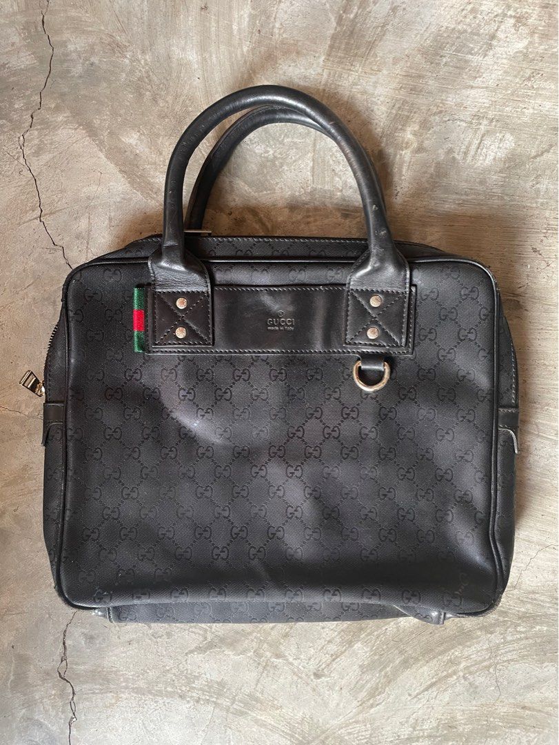 Gucci Laptop Bag (free shipping) (Category: Luxury Bags & Wallets) located in Calamba. Submitted by juan_jawnz (Listing ID 1293454419, Image 1). Description: What you see is what you get! It can fit documents and laptop! Dimensions: Width - 14 inches Length- 12 inches Issues: - It does not have the sling (based off photos from the internet) - very minor scratches on the bottom of the bag and handle Negotiable! Off/legit.