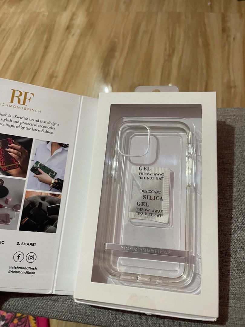 Richmond and Finch Clear Case - Iphone 12 Mini (Category: Cases & Sleeves) located in Malabon City. Submitted by AwchieeCollectibles (Listing ID 1293522115, Image 3). Description: This preloved. Used once. Richmond & Finch Clear Case for Iphone 12 Mini Bought in Rustans. Flaw: May clear mark sa may square (camera) na parang pandikit, when bought meron na talaga nun, pag ginamit naman sa phone hindi halata; seen in the last photo. To avoid inconve
