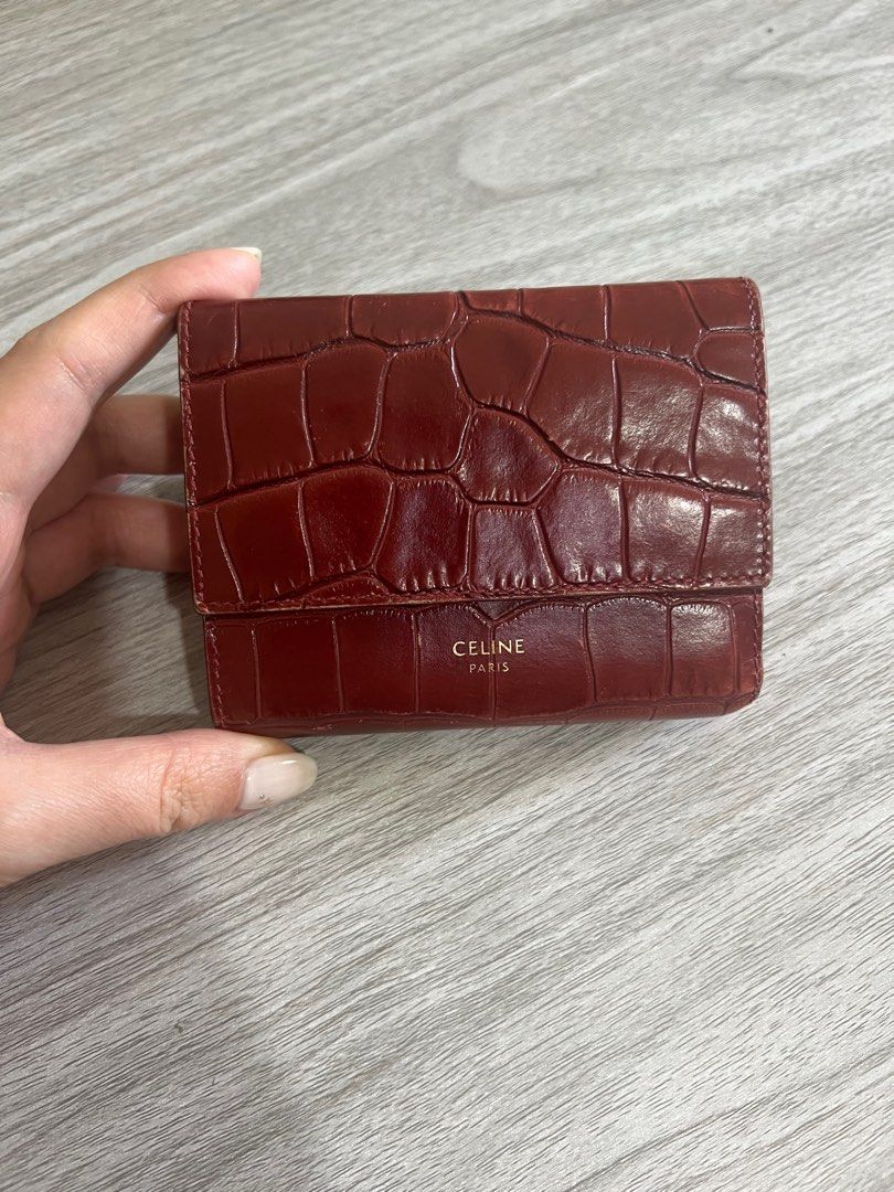 Celine Trifold Croc embossed wallet (Category: Luxury Bags & Wallets) located in Manila. Submitted by crazyxfashion (Listing ID 1293627436, Image 1). Description: Celine SMALL TRIFOLD WALLET IN CROCODILE EMBOSSED CALFSKIN in Burgundy 2019 model No inclusions Bought for 40k RFS Decluttering .