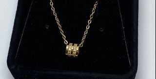 Gold necklace burvon like with jewelry box