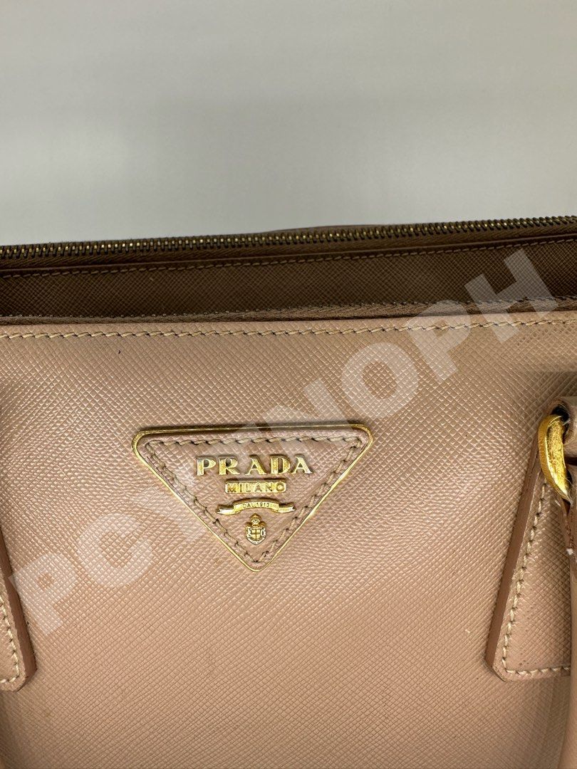 Prada Galleria Beige - Medium (Category: Luxury Bags & Wallets) located in Manila. Submitted by pcyph (Listing ID 1293719830, Image 3). Description: Prade Galleria Medium - Guaranteed Authentic With heavy signs of use (please check photos) Marks not that visible when used. A little restoration will restore its beauty Slightly Negotiable Inclusion: • Dust Bag •Key Holder •Strap OPEN FOR MEET UP OPEN FOR ENTRUPY (Buyer’s Expense) Accepts Cash, Bank