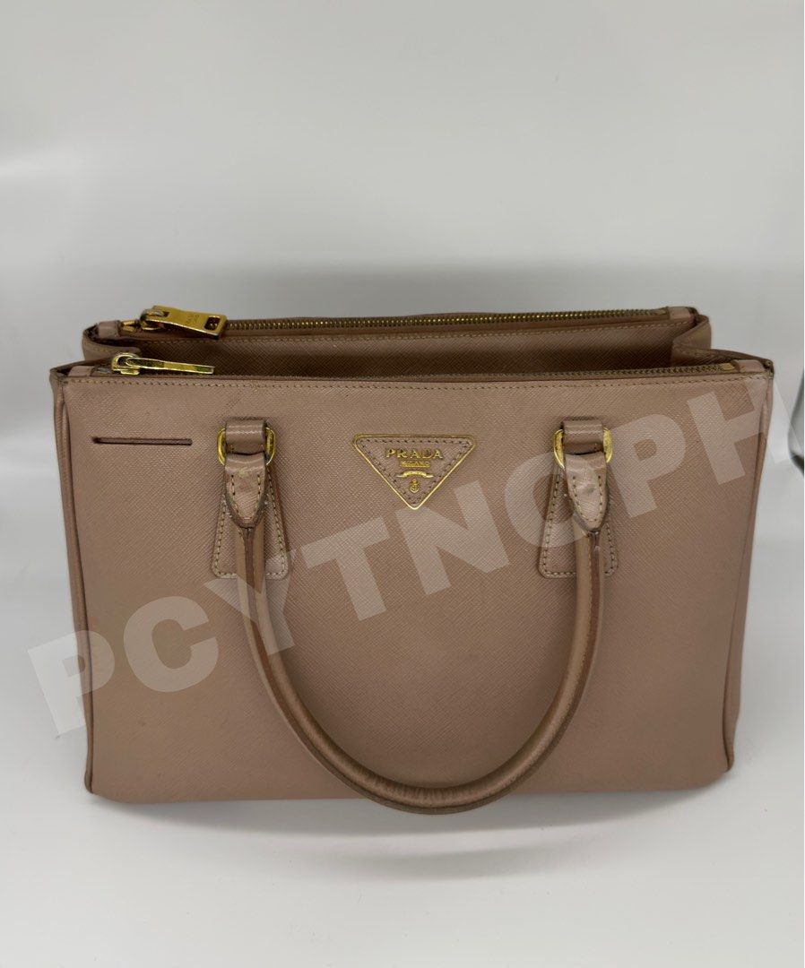 Prada Galleria Beige - Medium (Category: Luxury Bags & Wallets) located in Manila. Submitted by pcyph (Listing ID 1293719830, Image 2). Description: Prade Galleria Medium - Guaranteed Authentic With heavy signs of use (please check photos) Marks not that visible when used. A little restoration will restore its beauty Slightly Negotiable Inclusion: • Dust Bag •Key Holder •Strap OPEN FOR MEET UP OPEN FOR ENTRUPY (Buyer’s Expense) Accepts Cash, Bank
