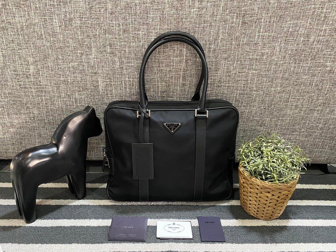Prada Laptop Bag (Category: Luxury Bags & Wallets) located in Manila. Submitted by bagislifeshop (Listing ID 1293717982, Image 1). Description: 100% Authentic Prada Laptop Bag Condition 9/10 Comes with Standard Dustbag/Authenticity Card .